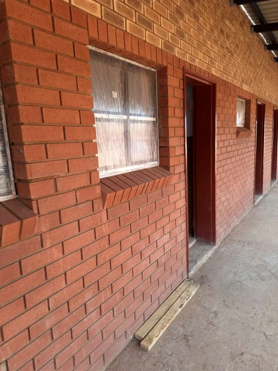Brick facade and covered walkway at a completed project