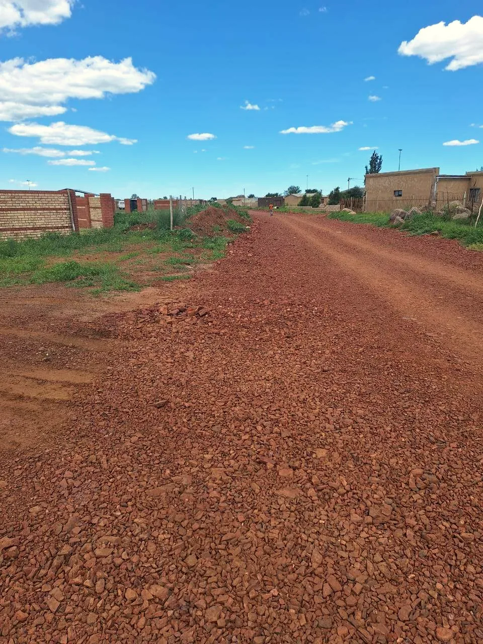Freshly graded gravel access road on a Hlwella site
