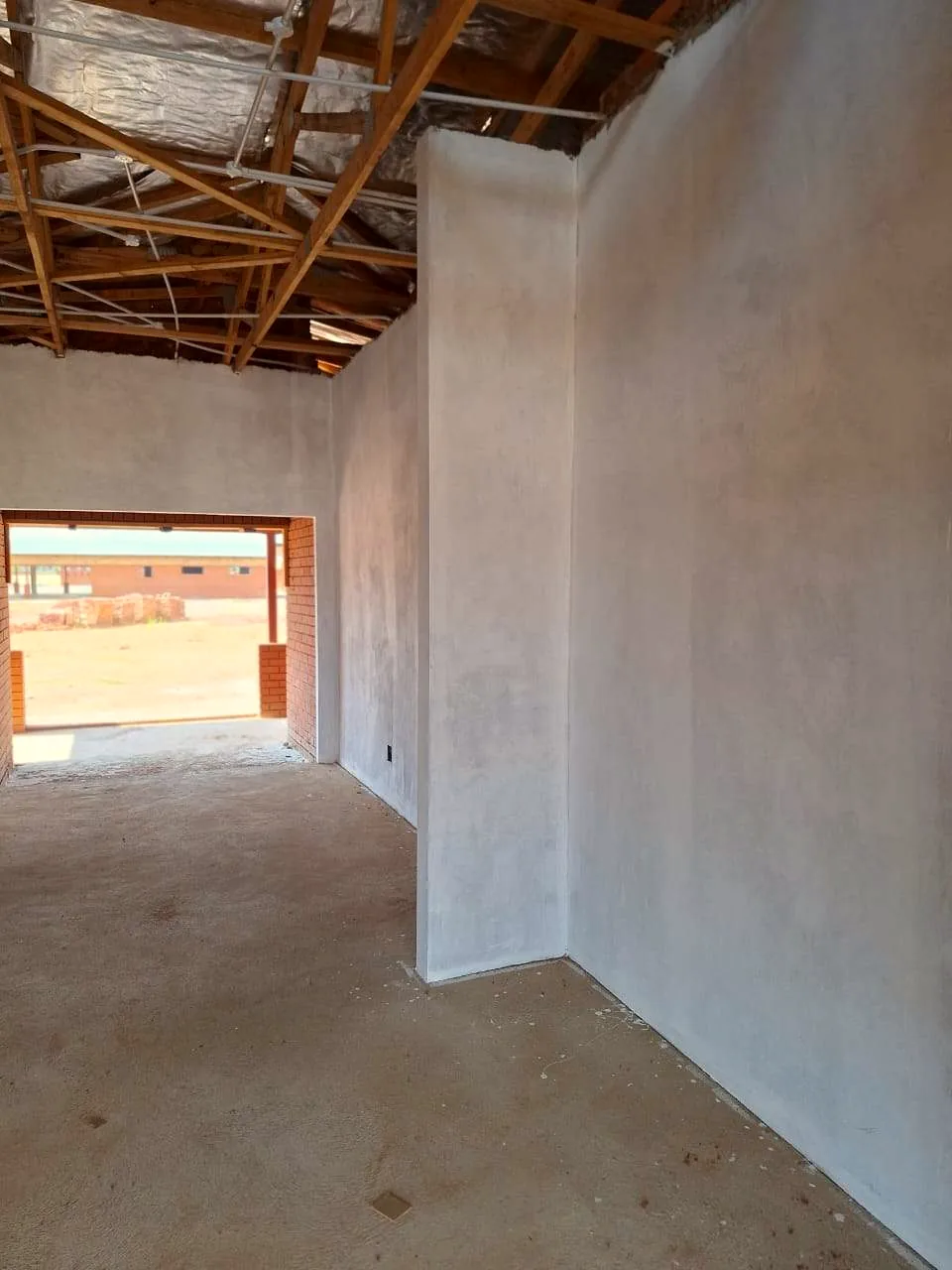 Freshly plastered interior of a refurbished classroom