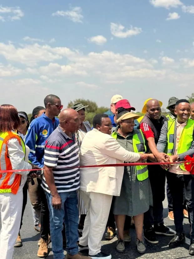 Ribbon-cutting at a Hlwella project handover with community and client representatives