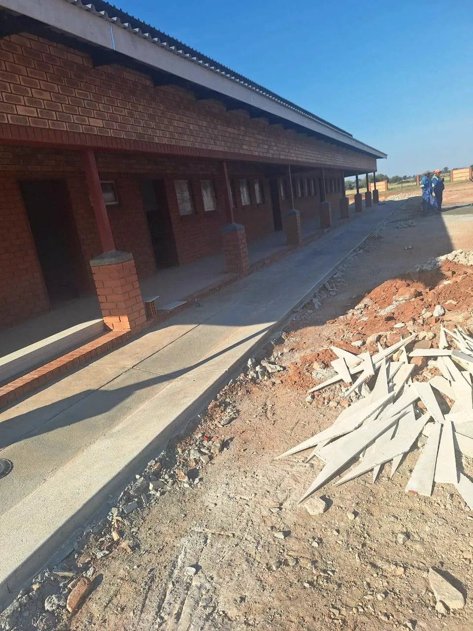 Completed school block with covered veranda, built by Hlwella